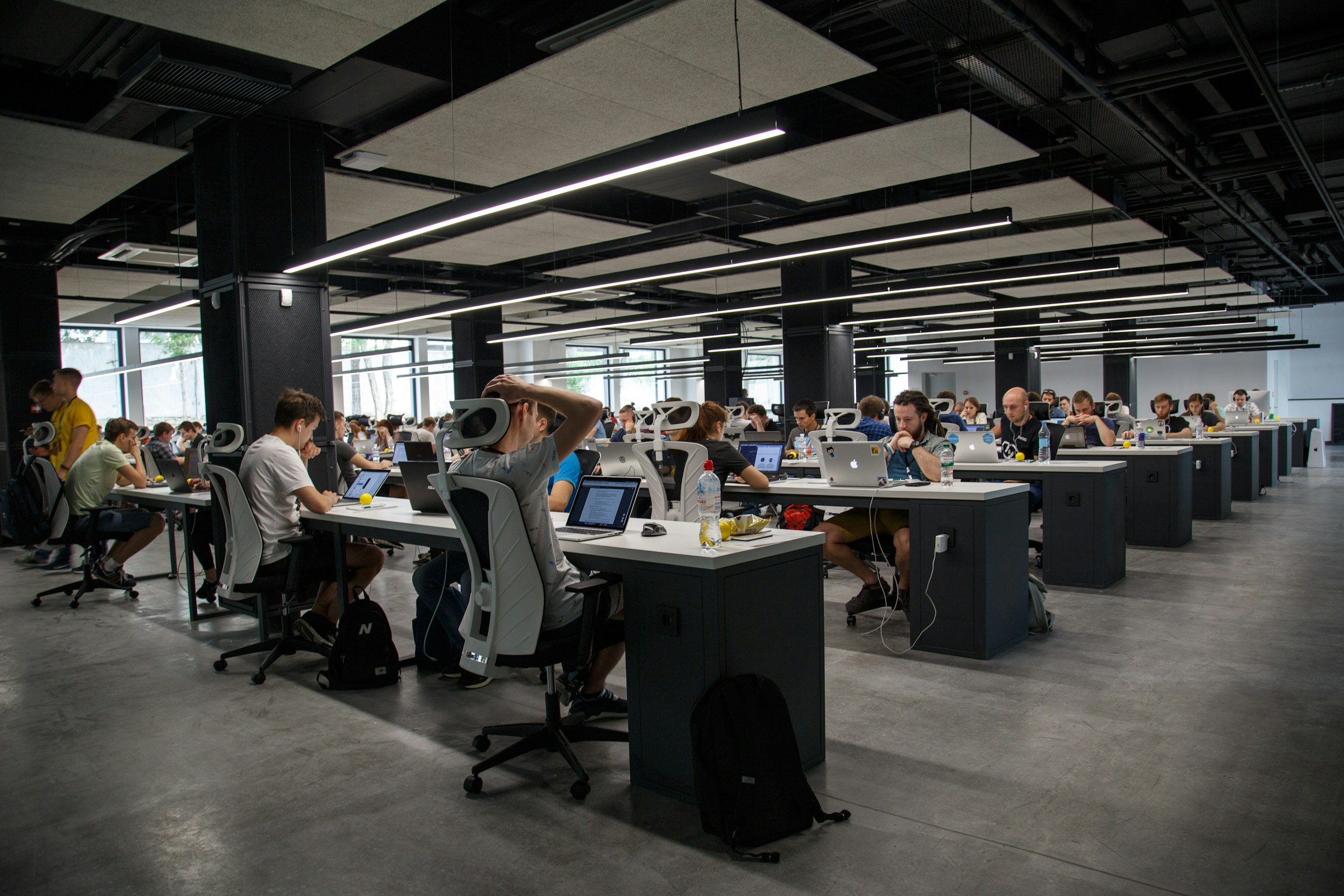 A collaborative workspace with people working at shared desks